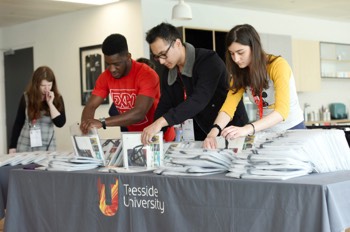  Dan Lucas, Asya Al Kooheji and Yacouba Traore helping set this years registration desk  