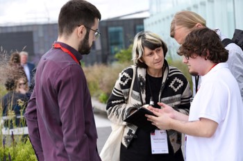  Marta Di Francesco talking to BSc Games Programming student Ruben De La Fuente on the 5th floor balcony  